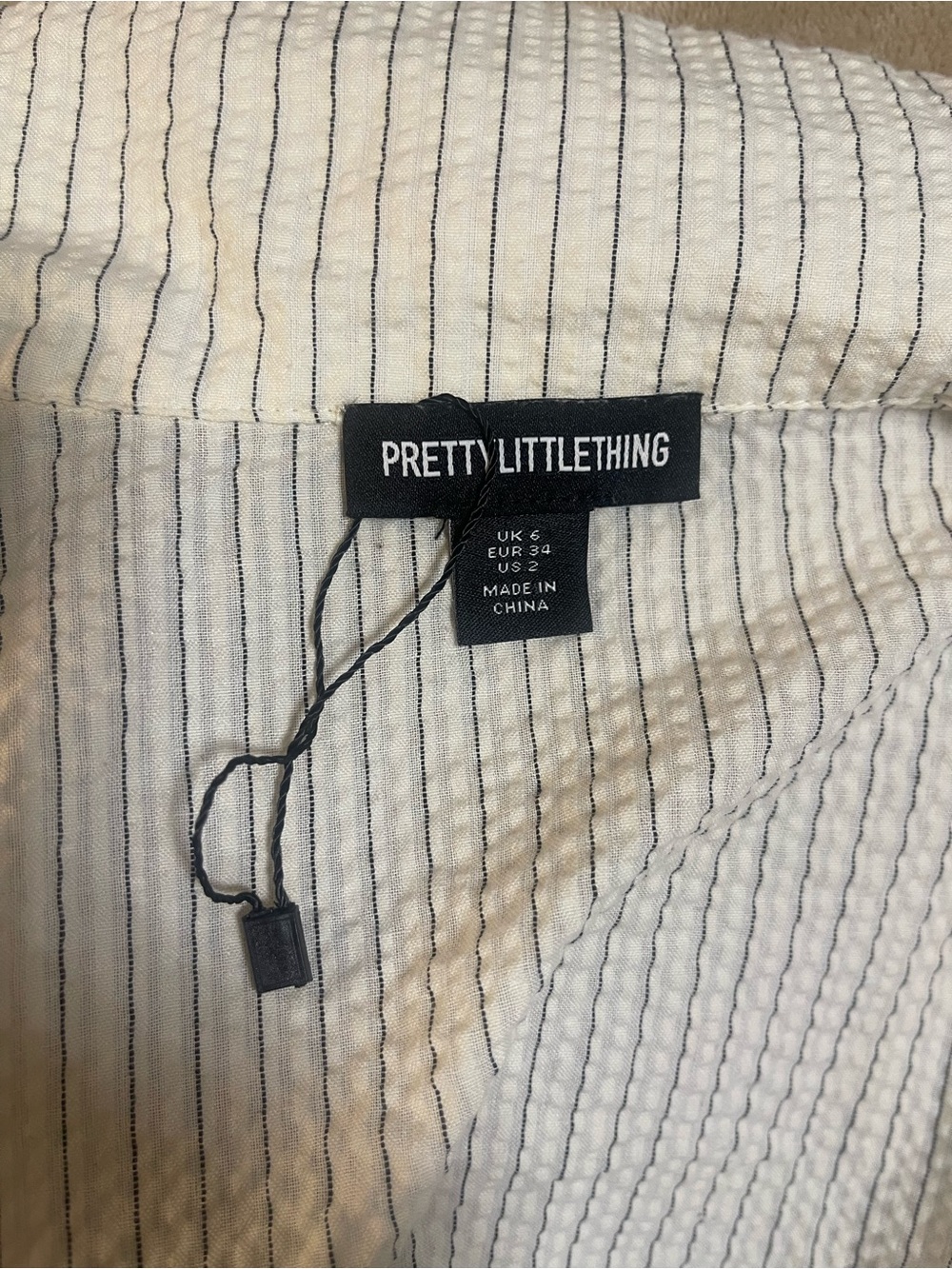 PrettyLittleThing Cream Striped Ruffle-Front Button Down Top - Picture 6 of 8